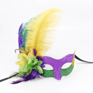 Close-up of Mardi Gras mask with purple, green and gold feathers for carnival parties