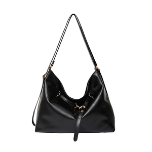 Large black leather hobo bag with gold hardware and slim straps on a white background