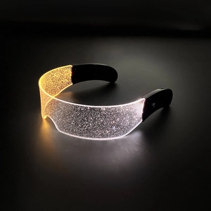 Futuristic LED luminous glasses with warm and white lights on a black background