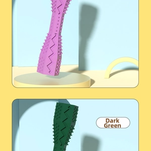 Detail view of purple and green dog chew toys with cleaning bristles and massage nubs