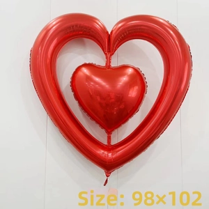 Detail of red heart-in-heart foil balloon showing metallic luster and 98x102cm size