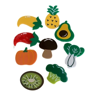 9-piece set of cartoon fruit and vegetable acetate hair clips on a white background