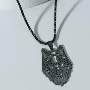 Close-up of geometric wolf head pendant with black metal chain for men