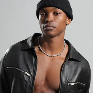 Close-up of hip-hop silver bone chain necklace with sparkling crystals on a male model