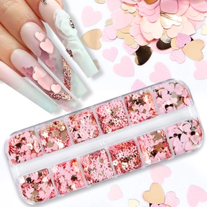 12-grid box of pink and gold heart-shaped nail art sequins with floral decorative glitters