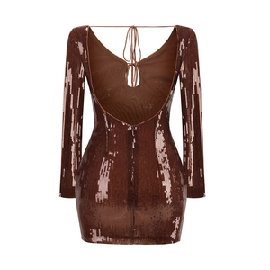 Detail of sequined bodycon dress featuring backless criss-cross straps and hidden zipper