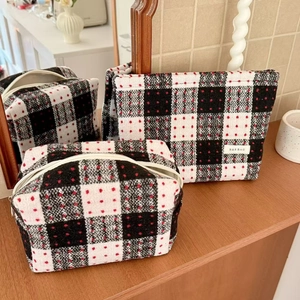 Three-piece set of plaid wool cosmetic bags with classic black and white checkered pattern