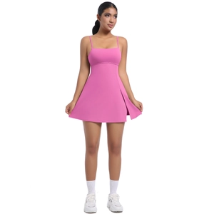 Detailed full view of a pink athletic tennis dress with slender straps and side slit design