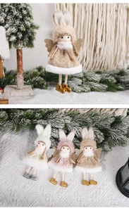 Close-up of plush angel ornaments with bunny ears and golden wings for Christmas trees