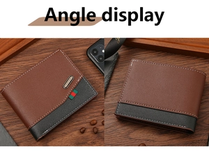 Detail of vintage men's wallet showing brown leather stitching and luxury metal logo