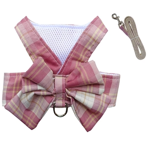 Close-up of pink plaid pet harness vest and leash set with mesh and bow detail