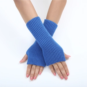 Close-up of blue knitted fingerless gloves with fine striped texture on model hands