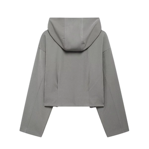 Back view of a minimalist grey cropped hooded jacket with a sporty knitted design