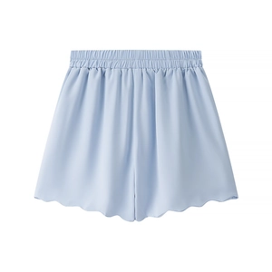 Detail of light blue high-waist shorts with elastic waistband and wavy petal hemline