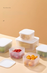Detailed view of translucent storage bins with white lids for fresh kitchen organization