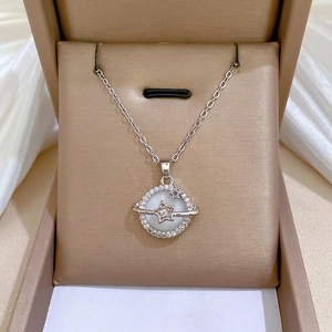Star and planet shell pendant necklace with zircon crystals in a luxury jewelry box