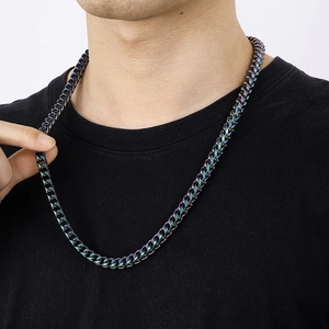 Close-up of a colorful iridescent dragon link chain necklace worn on a male model neck