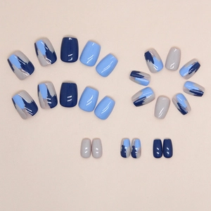 Short T-shape press-on nails in deep blue and grey with abstract oil painting strokes