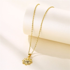 Golden sun totem pendant necklace with zircon stones on a minimalist gold chain