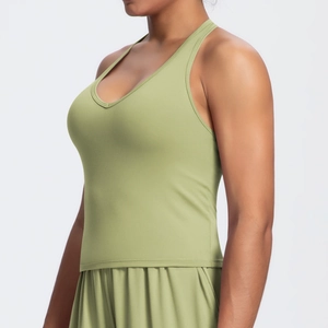 Close-up of avocado green brushed sports top showing high-stretch fabric and V-neck line