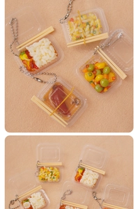 Detailed view of miniature Japanese bento box keychains with realistic resin food models