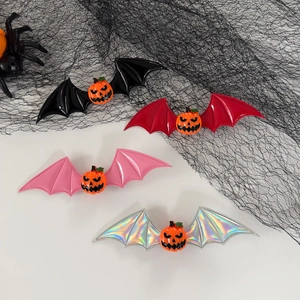 Halloween bat wing hair clips with pumpkin accents in black, red, pink, and silver set
