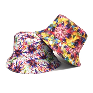 Detail shot of tie-dye bucket hats with psychedelic floral fractal patterns on white background