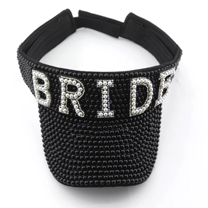 Detailed top view of black sun visor featuring BRIDE pearl lettering and beadwork