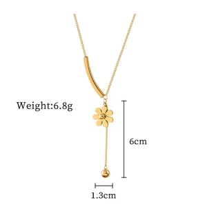 Detail of titanium steel necklace showing 1.3cm flower charm and 6cm beaded drop chain