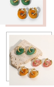 Detail of 18K gold-plated hoop earrings with green, orange and pink natural stone charms