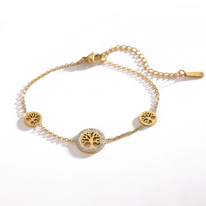Detail of gold tree of life pendants with sparkling crystals on stainless steel chain