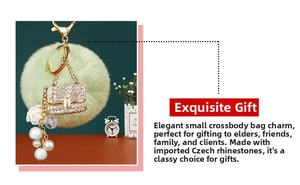Detail of luxury green plush ball keychain with crystal bag pendant and pearl accents