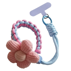Pink and blue braided paracord phone wrist strap featuring a knitted flower charm