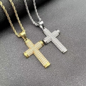 Detail of hip hop cross necklaces in gold and silver finish with crystal pavé stones