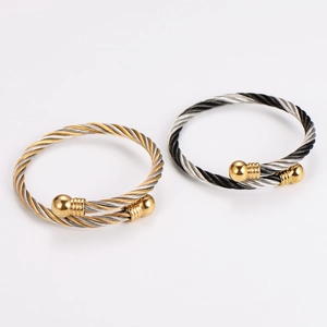 Retro stainless steel twisted cable bangle featuring two-tone interwoven design and metal ball ends