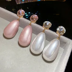 French vintage elegant drop earrings with round diamonds and pearlescent waterdrop pearls