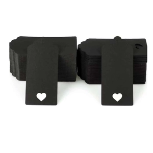 Set of two black paper gift tags featuring a scalloped top and heart-shaped cutout design