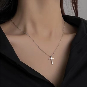 Minimalist S925 sterling silver cross pendant necklace worn on a female model neck