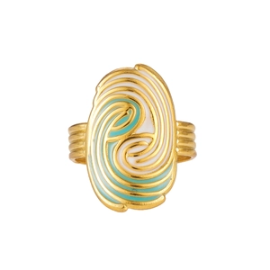 Detailed macro view of gold plated ring with blue and white enamel spiral pattern