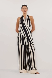 Detail of elegant black and white striped halter neck top and matching wide leg trousers