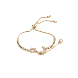 Adjustable golden bracelet with crescent moon and star charms set with sparkling cubic zirconia