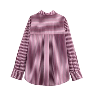Detailed back view of a purple and white striped long sleeve shirt with curved hem