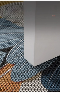 Detail showing the thin profile of an anti-slip entryway mat with a honeycomb texture
