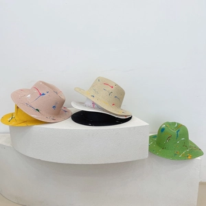 Artistic hand-painted straw sun hats in vibrant colors for summer fashion beach wear