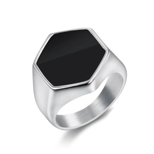 Macro shot of men's titanium steel ring with black stone and brushed metal texture