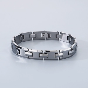 Detail of minimalist H-shaped black tungsten steel bracelet with smooth polished finish