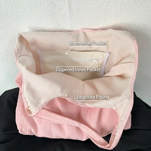 Pink pleated canvas tote bag interior with open pocket and zipper compartment