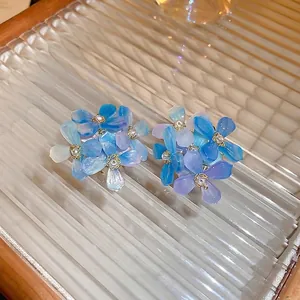 Gradient floral acrylic earrings with blue-purple petals and faux pearl stud accents
