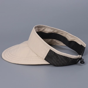 Detail of beige visor with black honeycomb mesh and adjustable elastic drawstring cord