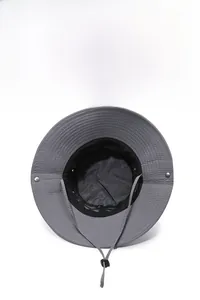 Detail of dark grey sun hat featuring breathable mesh lining and adjustable wind rope